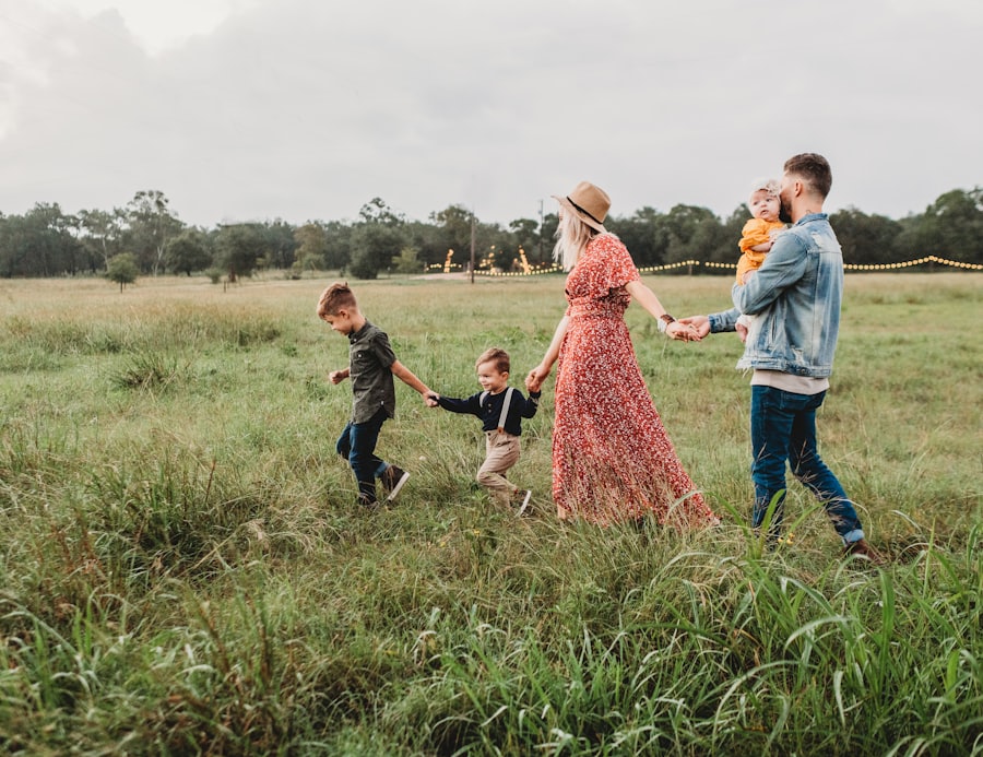 A young family walking together through a field
